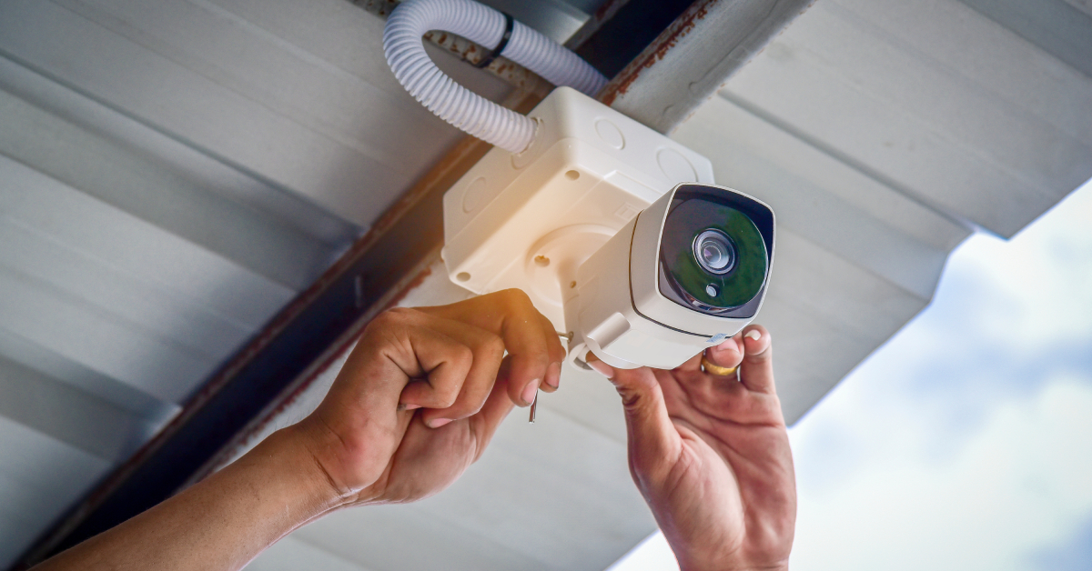 Technician installing CCTV camera system for security area